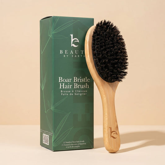 Boar bristle hair brush with packaging on a beige background