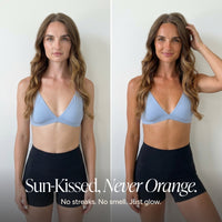 A side-by-side before/after style comparison of a woman wearing a light blue bralette and black high-waisted shorts against a plain light wall, with the text 'Sun-Kissed, Never Orange. No streaks.
