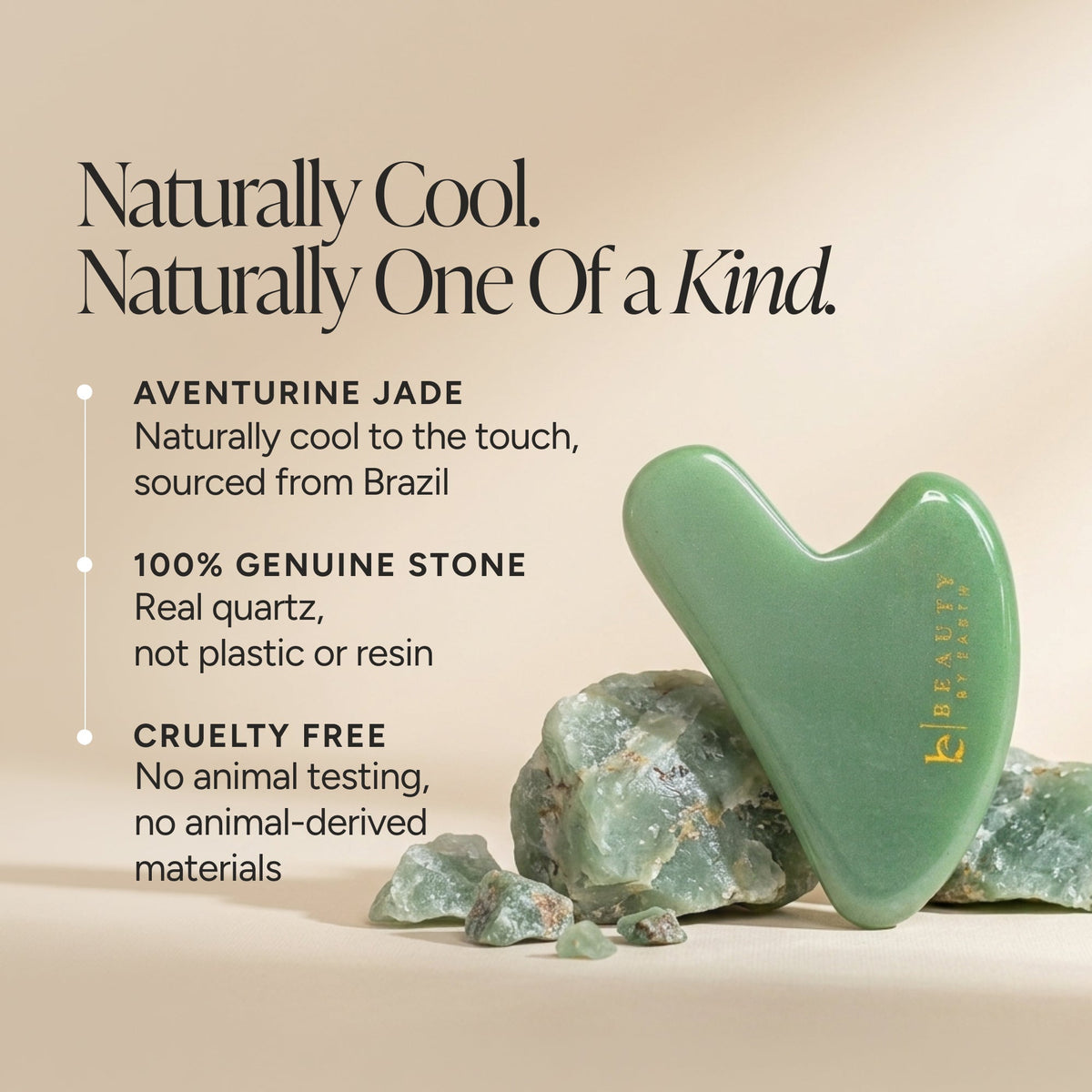 A heart-shaped green jade gua sha massage tool standing upright on a beige surface with loose green stones around it. Text on the left reads, 'Naturally Cool.