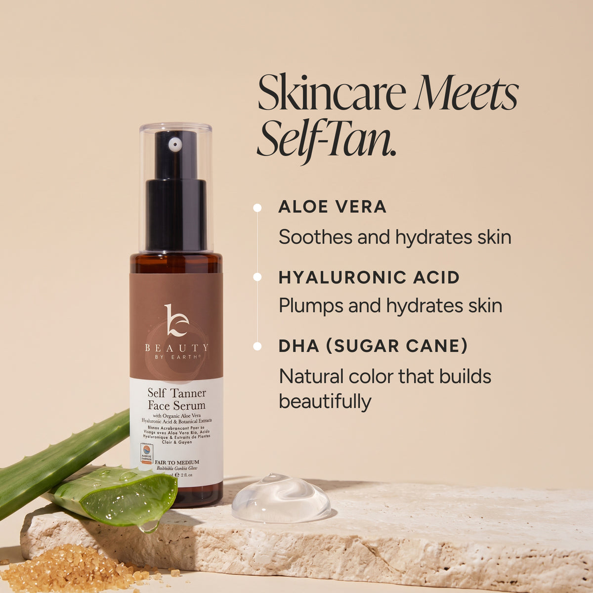 A bottle of Beauty by Earth 'Self Tanner Face Serum' stands on a stone slab with aloe vera leaves and a drop of serum beside it, against a warm beige background with product benefits text.