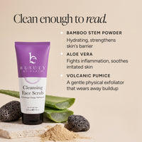 Beauty by Earth Cleansing Face Scrub in a purple and white squeeze tube, styled with aloe vera slices, volcanic lava rocks, and powder on a beige background with product text callouts.