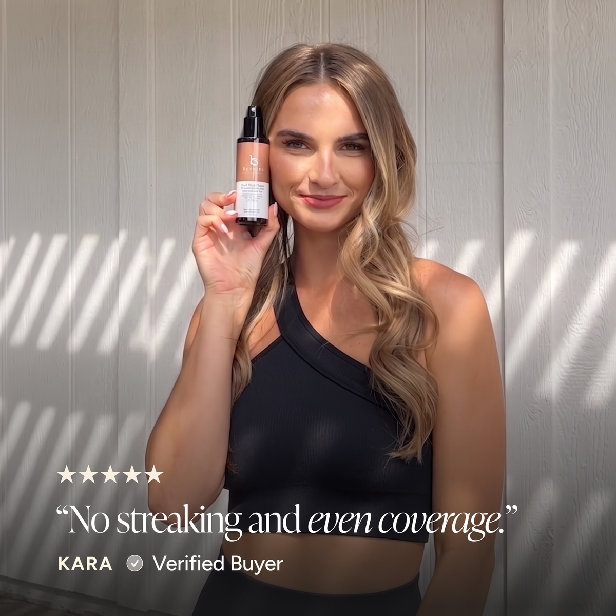 A woman in a black one-shoulder top holds up a bottle of bronzing face mist. Text at the bottom reads, 'No streaking and even coverage.