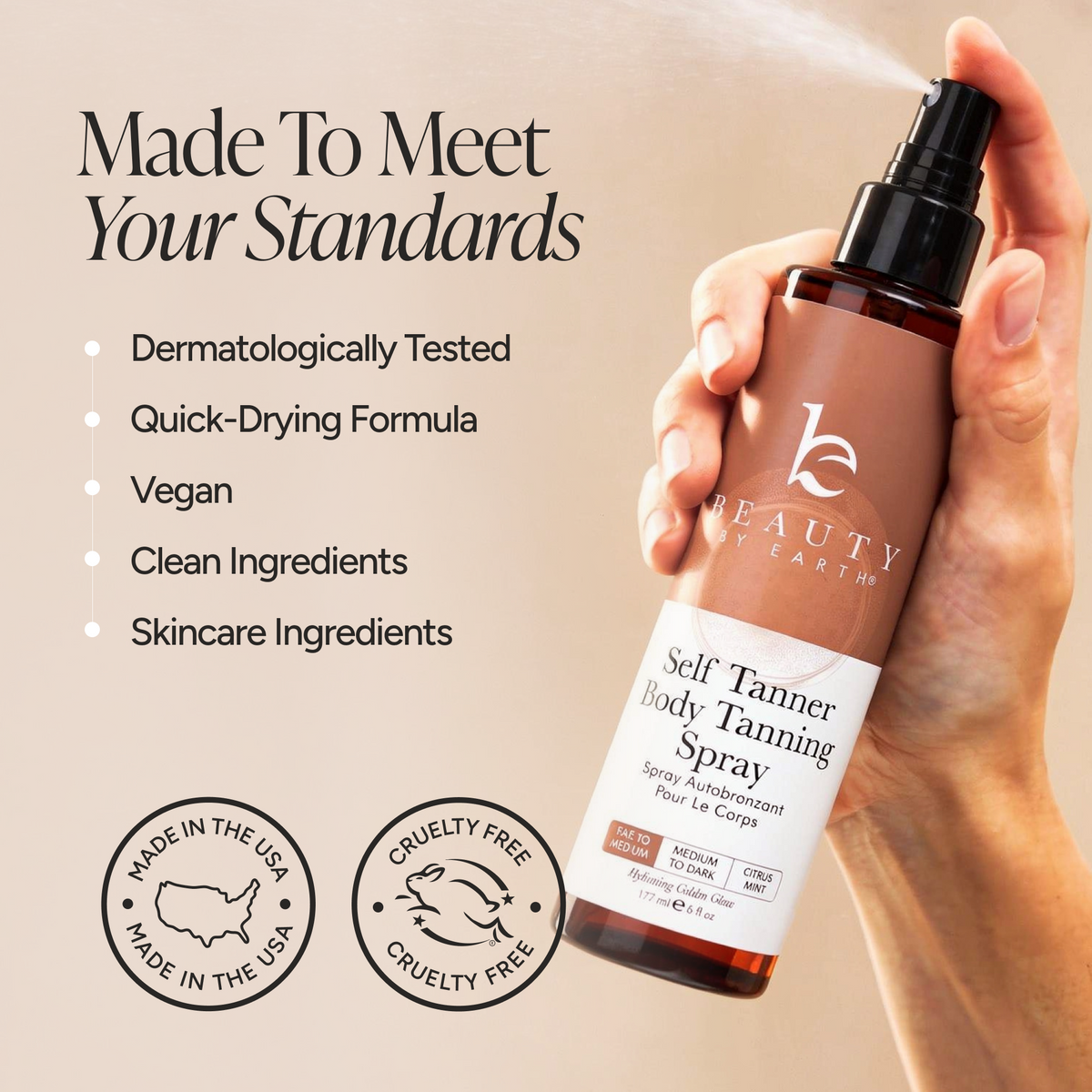 A hand holding a bottle of Beauty by Earth Self Tanner Body Tanning Spray against a beige background with marketing text and badges. The spray is being misted, and the bottle is amber brown with a black pump and a white label.