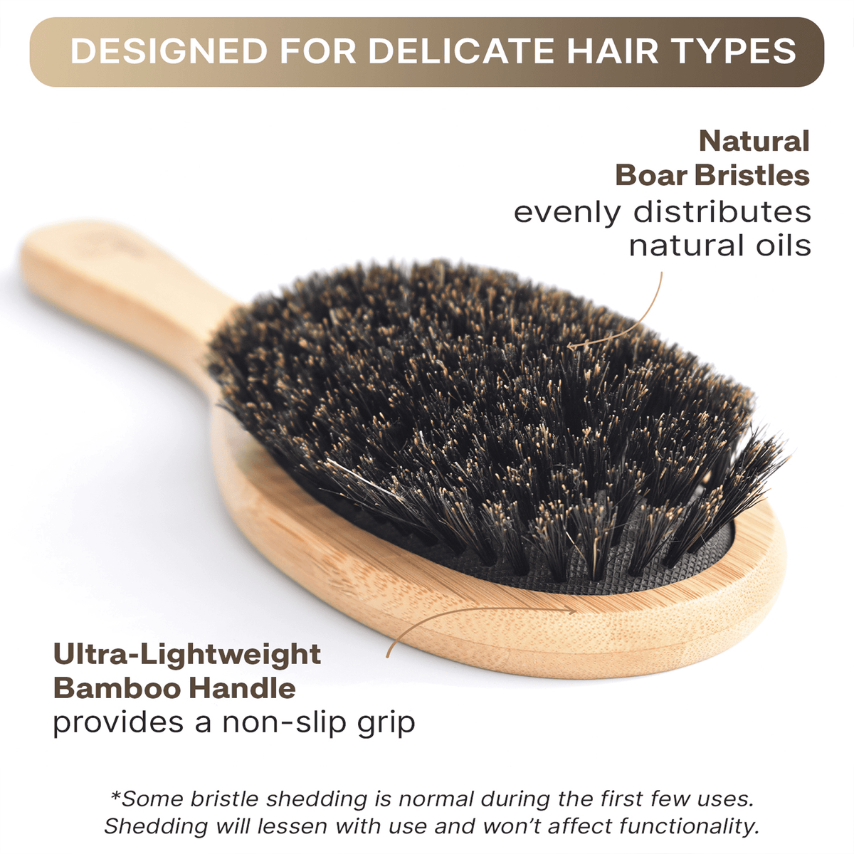 Hairbrush with natural boar bristles and wooden handle on a white background