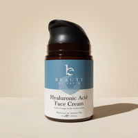 Jar of Hyaluronic Acid Face Cream with 'Beauty by Earth' branding on a beige background