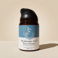 Jar of Hyaluronic Acid Face Cream with 'Beauty by Earth' branding on a beige background