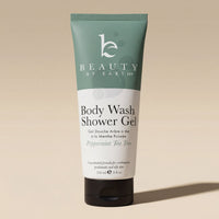 Body wash shower gel peppermint tea tree tube with 'Beauty by Earth' branding