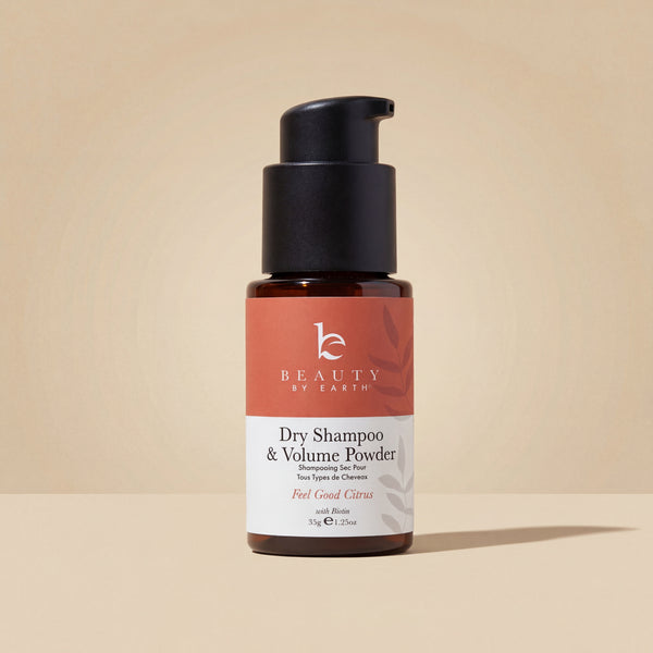 Beauty by Earth dry shampoo and volume powder bottle on a white background