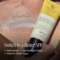 A close-up of a hand holding a tube of Beauty by Earth Barrier Protection Mineral Sunscreen SPF 50 against a skin surface with a smear of translucent sunscreen. White promotional text at the bottom reads 'Switch to a Better SPF' with bullet points about reef friendly, dermatologist tested, and great for all skin types.