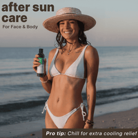 Woman in a bikini holding an after sun care product on a beach