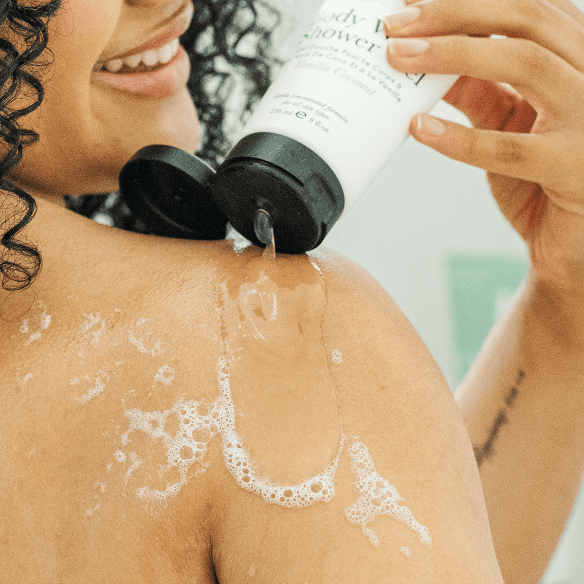 A model using body wash shower gel on body
