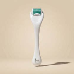 Derma Roller on beige background