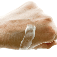 Hand with soap lather on a white background
