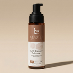 Bottle of 'Self Tanner Mousse' by Beauty by Earth on a beige background