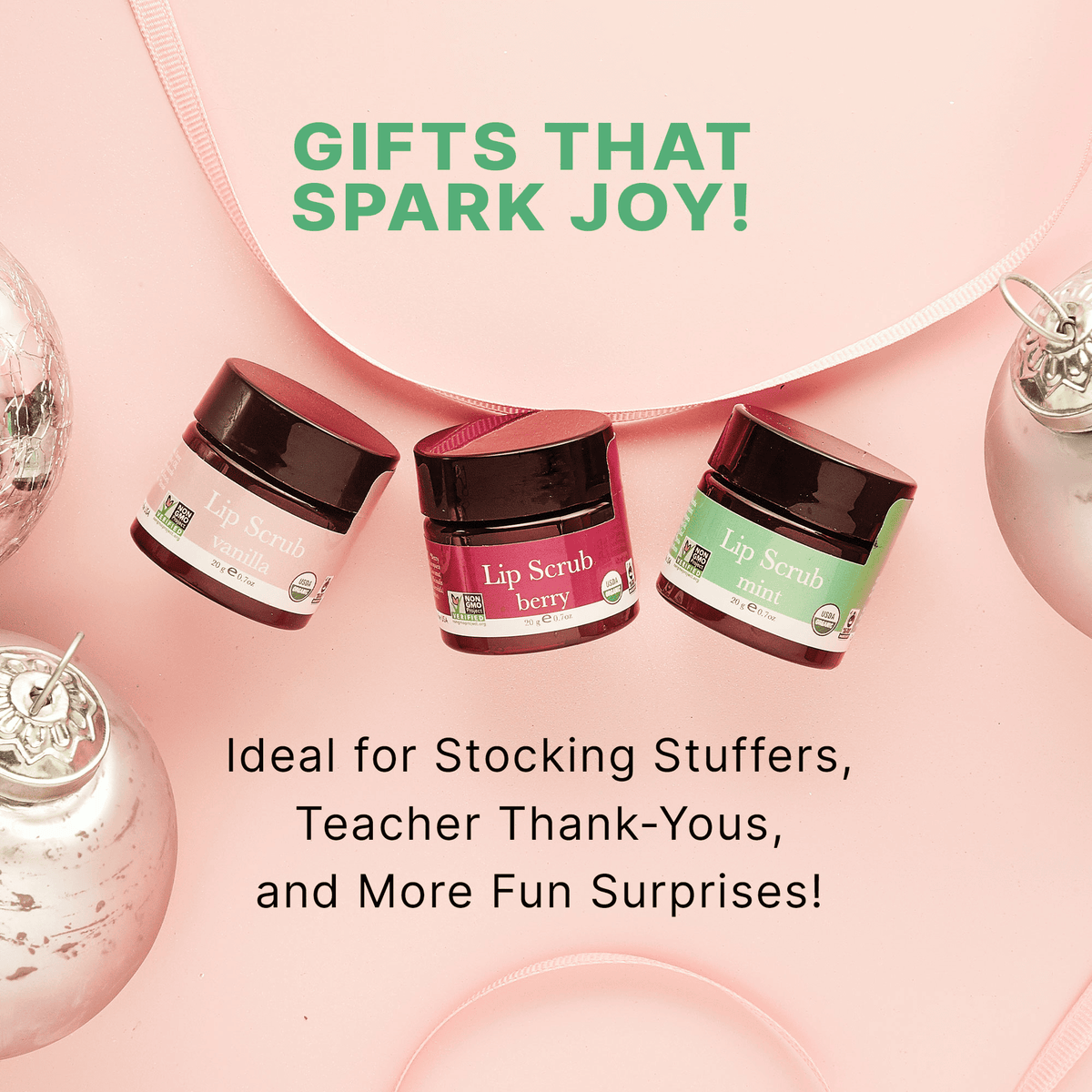 Three lip scrub jars on a pink background with text about gifts that spark joy.