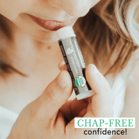 Person applying lip balm with a focus on 'Chap-Free Confidence' text.