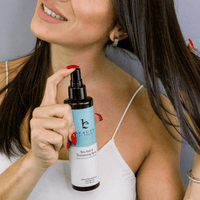 Woman with Sea Salt Spray Hair Texturizer, suitable for clean beauty routines and natural hair care