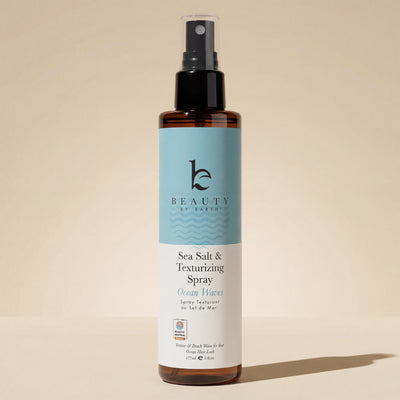 Sea Salt Spray Hair Texturizer bottle for natural volume and texture, vegan formula, on beige backdrop