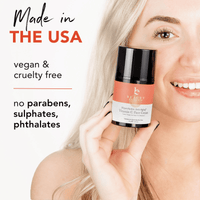 Woman holding a skincare product with text about vegan, cruelty-free, and ingredient-free qualities.