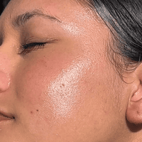 Close-up of a person's face with sun-kissed skin