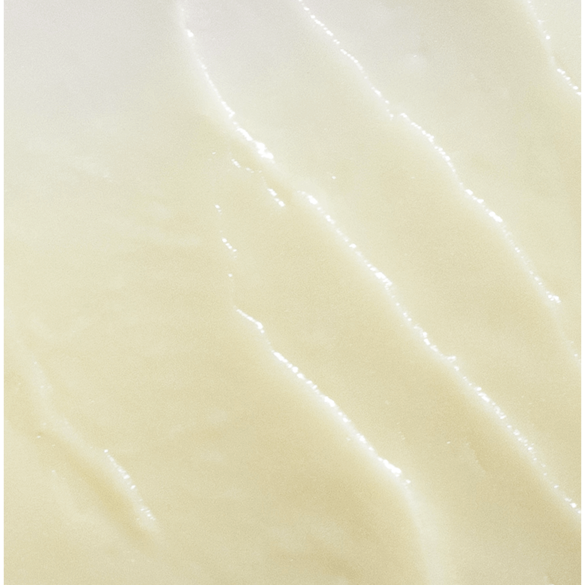 Close-up of a smooth, light-colored surface with subtle texture