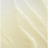 Close-up of a smooth, light-colored surface with subtle texture